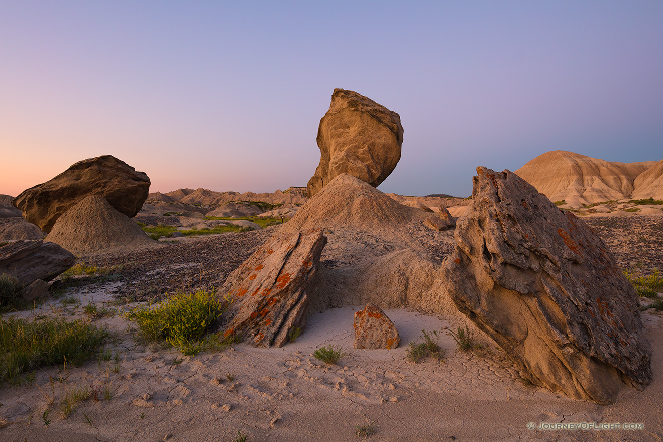 The badlands landscape at Toadstool Geologic Park is quiet in the twilight just before sunrise on a summer morning. - Nebraska Picture