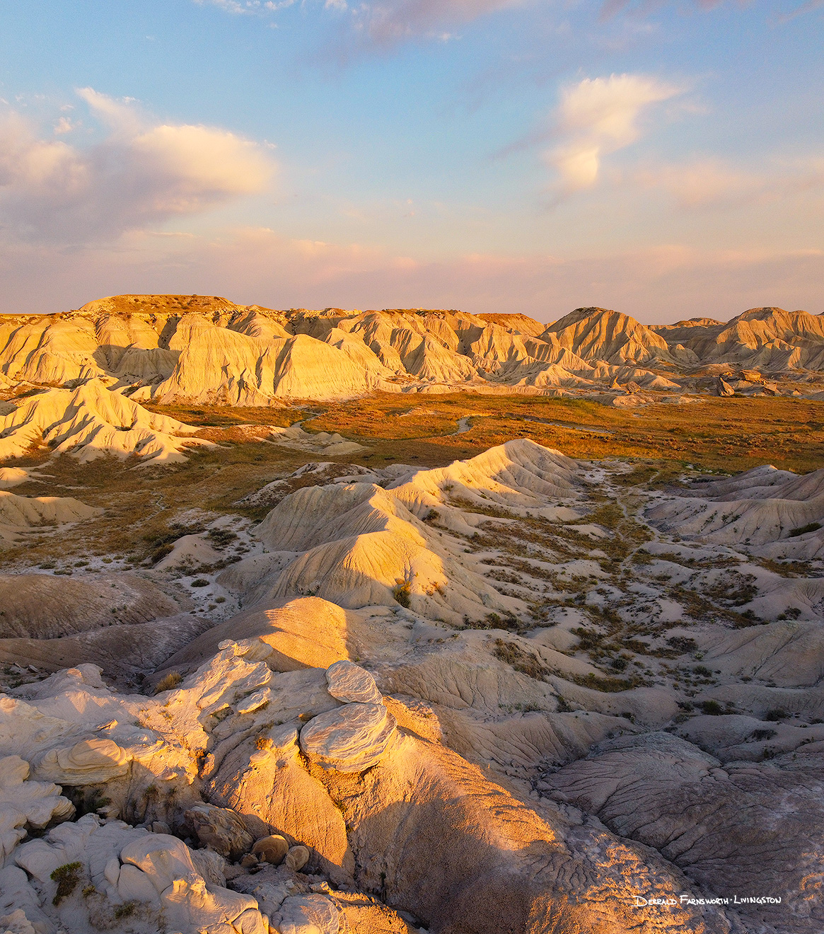 A vertical scenic photograph of the badlands Toadstool Geologic Park in western Nebraska. - Nebraska Picture