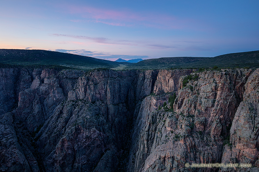 As twilight descends into the Black Canyon of the Gunnison blue hues dominate the sky and the walls. - Colorado Photography