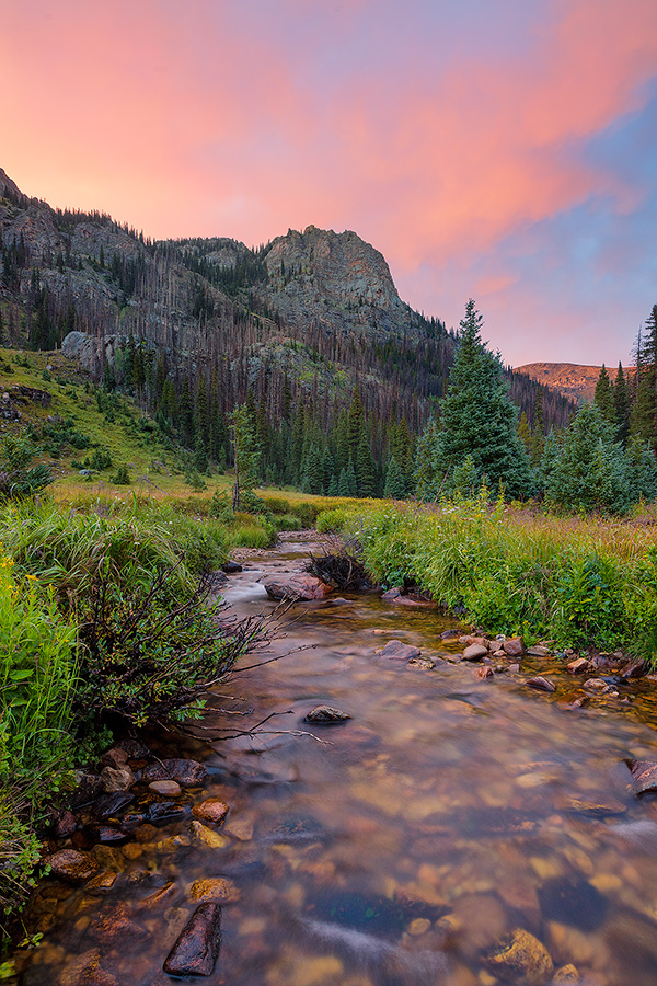 A scenic photograph of Tonahutu creek and a sunset at Rocky Moutain National Park, Colorado. - Colorado Photography