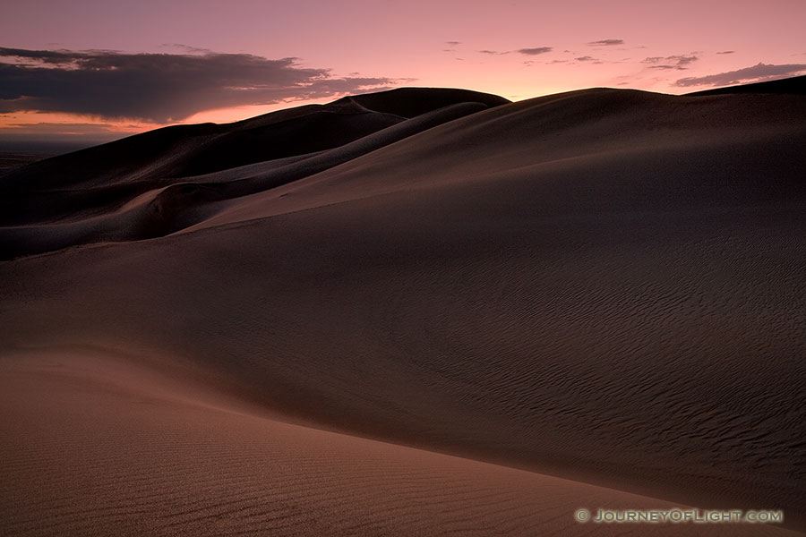 As I photographed this scene, I almost imagined myself in a foreign land as the sun dipped below the horizon.  The shapes of the dunes in this photo become abstract lines and patterns in the late dusk light. - Great Sand Dunes NP Photography