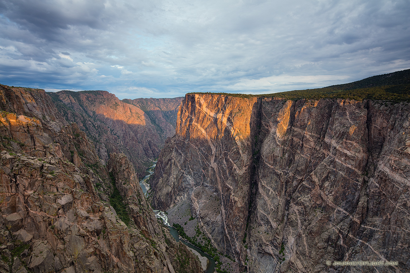 Sunlight illuminates the walls of the Black Canyon of the Gunnison just after sunrise. - Colorado Picture