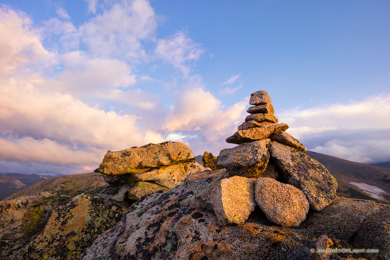 High up in Rocky Mountain National park a cairn stands witness to a beautiful morning across the tundra. - Colorado Picture
