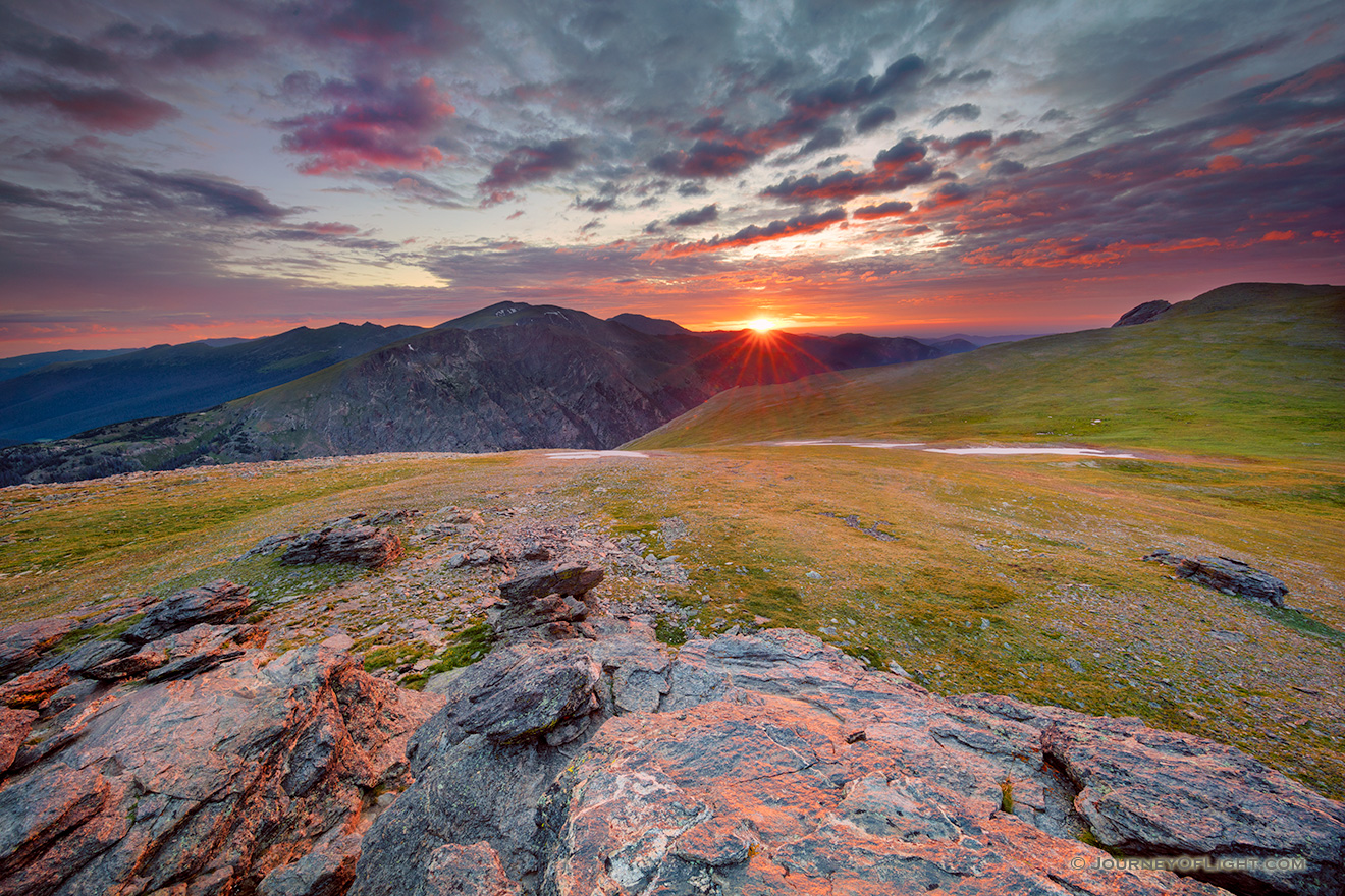 A photograph of a beautiful sunset on the tundra landscape of Rocky Mountain National Park in Colorado. - Colorado Picture