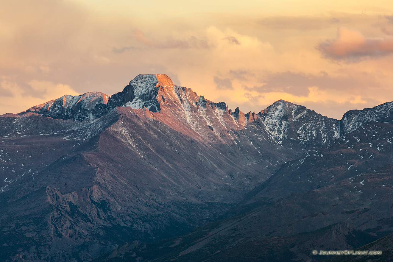 Long's Peak's western face glows with the last warm hues of sunset. - Rocky Mountain NP Photography