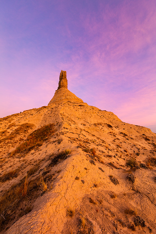 A scenic vertical landscape Nebraska photograph of a sunset and Chimney Rock in western Nebraska. - Nebraska Photography