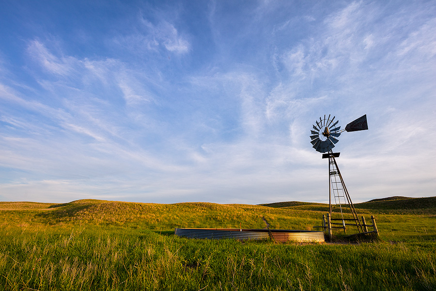 Late afternoon sun illuminates an abandoned windmill deep in the Sandhills of Nebraska. - Nebraska Photography