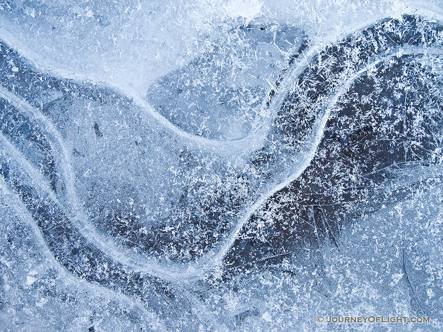Bubbles and lines form an abstract pattern in the frozen ice in Stone Creek at Platte River State Park. - Platte River SP Photography