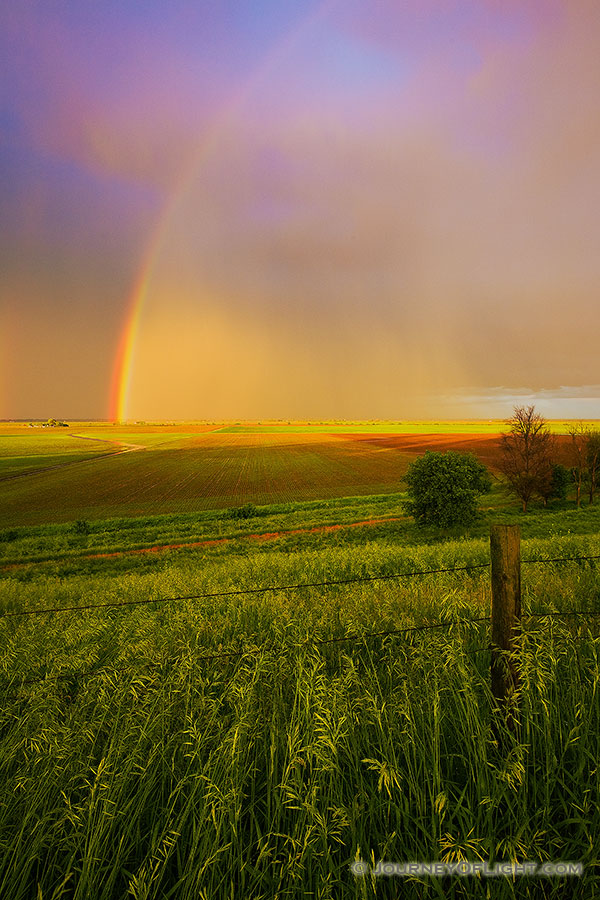 After a rain storm a stunning rainbow touches the ground on the Missouri Valley plains. - Nebraska Photography