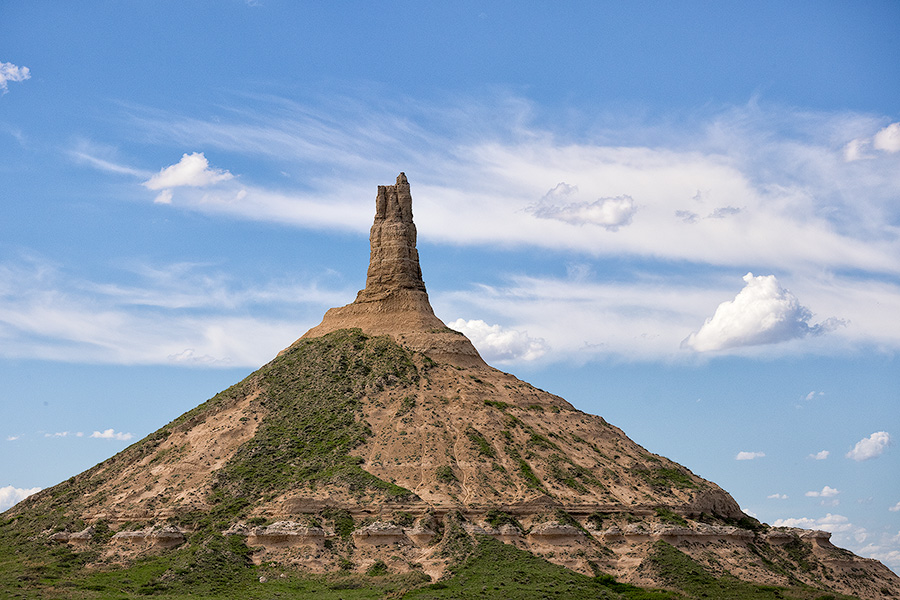 Clouds float above Chimney Rock, once a beacon to pioneers headed to the west for a better life. - Nebraska Photography