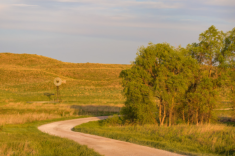 Nebraska photography of a road and windmill in the Sandhills. - Nebraska Photography