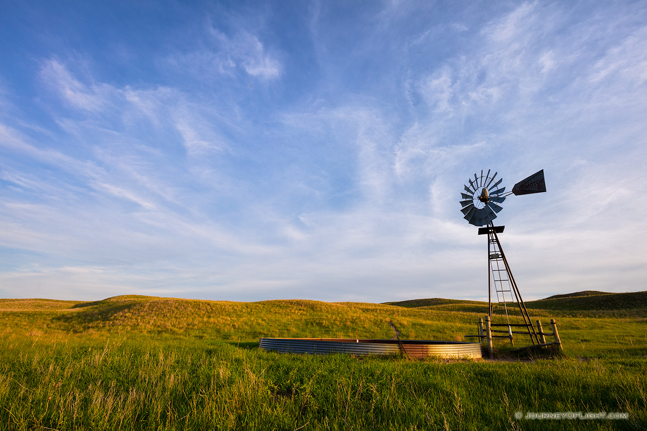 Late afternoon sun illuminates an abandoned windmill deep in the Sandhills of Nebraska. - Nebraska Picture