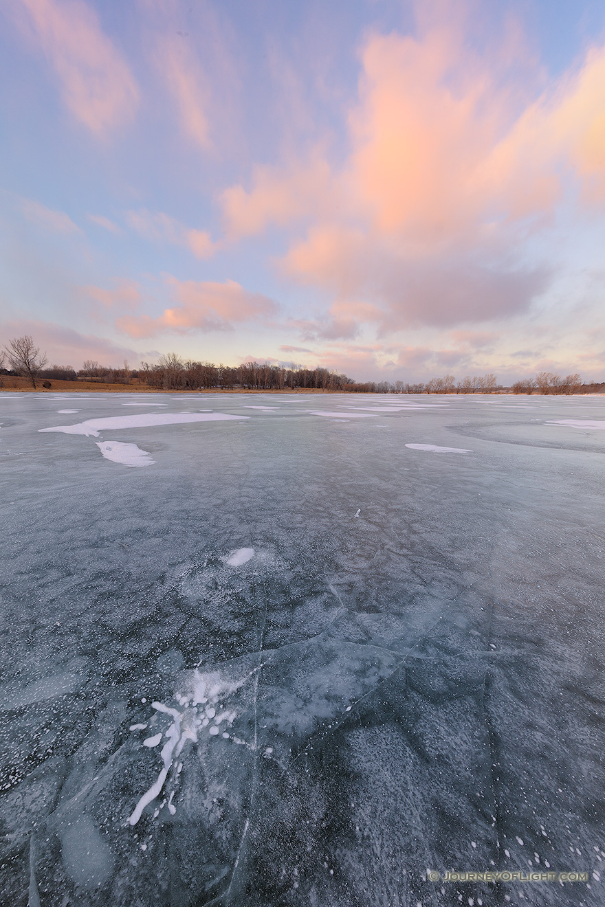 On a frigid January day clouds hover over the frozen Wehrspann Lake at Chalco Hills Recreation Area in Sarpy County, Nebraska. - Nebraska Picture