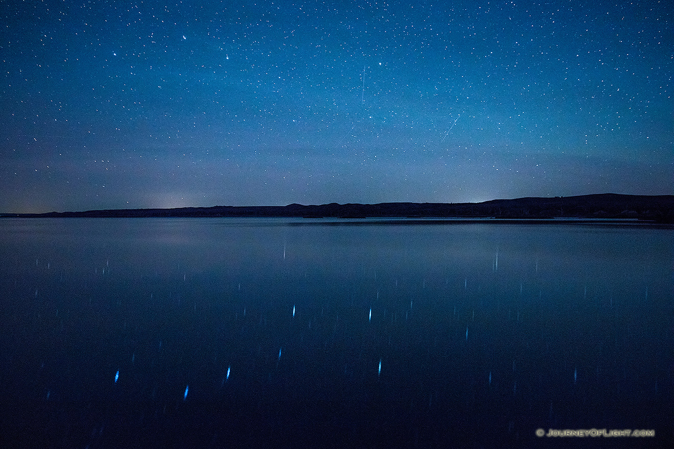 On a clear night at Niobrara State Park the stars shone brightly above the Missouri River.  In the reflection of the river the Big Dipper can be clearly seen. - Nebraska Picture