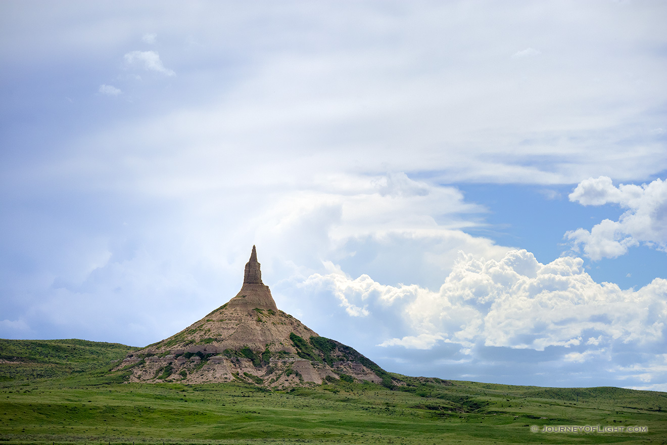 Afternoon storm clouds gather in the west billowing above Chimney Rock in the panhandle of Nebraska. - Nebraska Picture