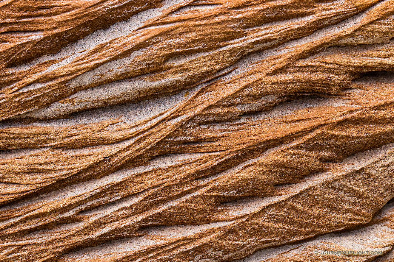 An abstract pattern caused by erosion in rocks embedded in the bluffs in Theodore Roosevelt National Park. - North Dakota Picture