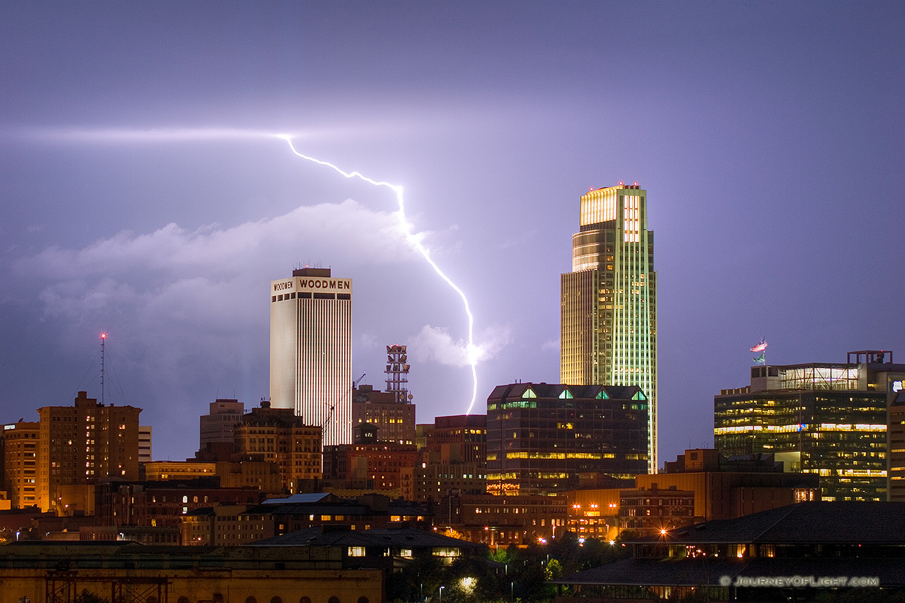 While setting up to capture the 9/11 tribute in downtown Omaha I instead witnessed a spectacular fall storm.  I managed to capture this lightning between the Woodmen Tower and the First National Bank Tower. - Omaha Picture