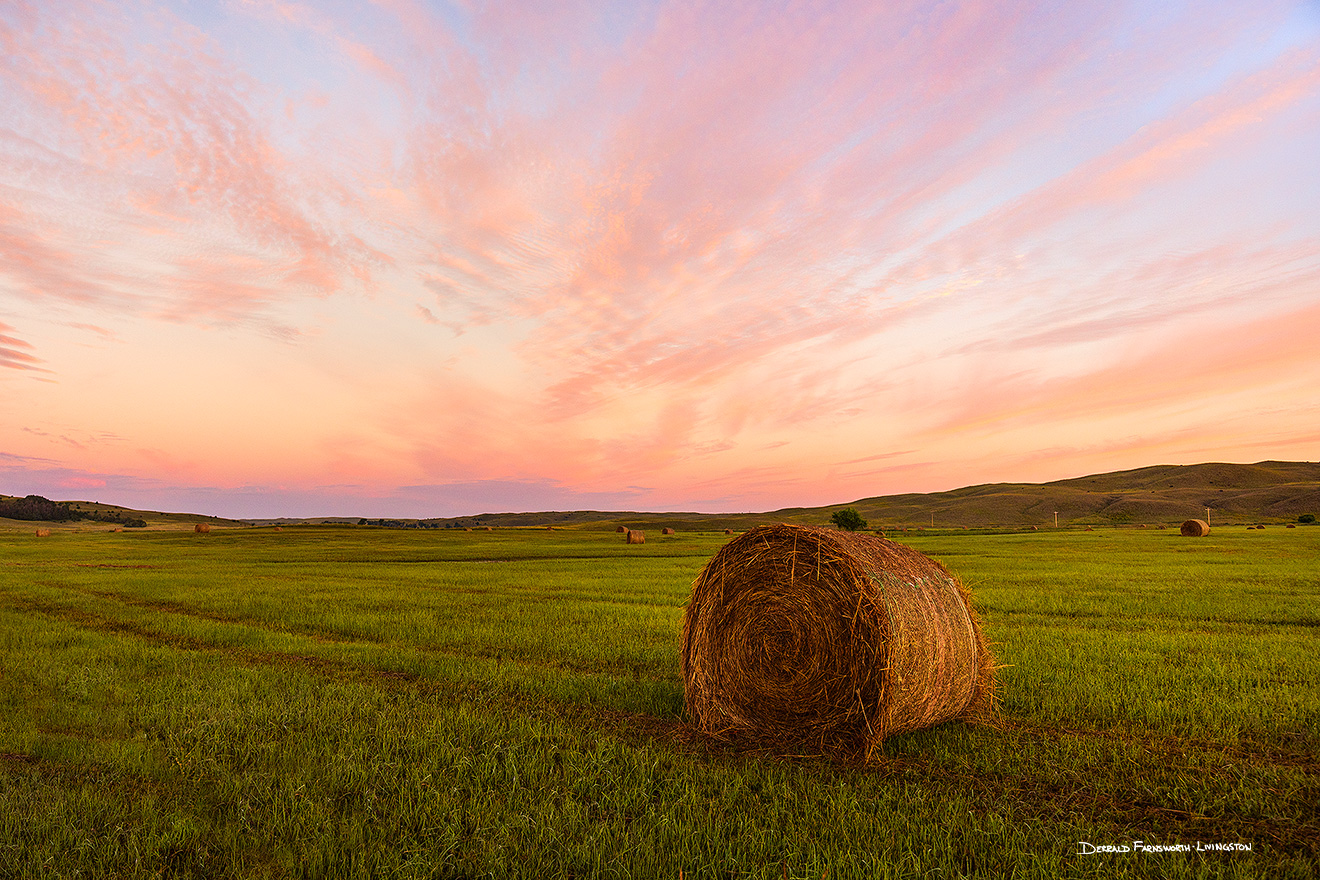 A scenic landscape photograph of hay bales and solitude in the sandhills of Nebraska. - Nebraska Picture