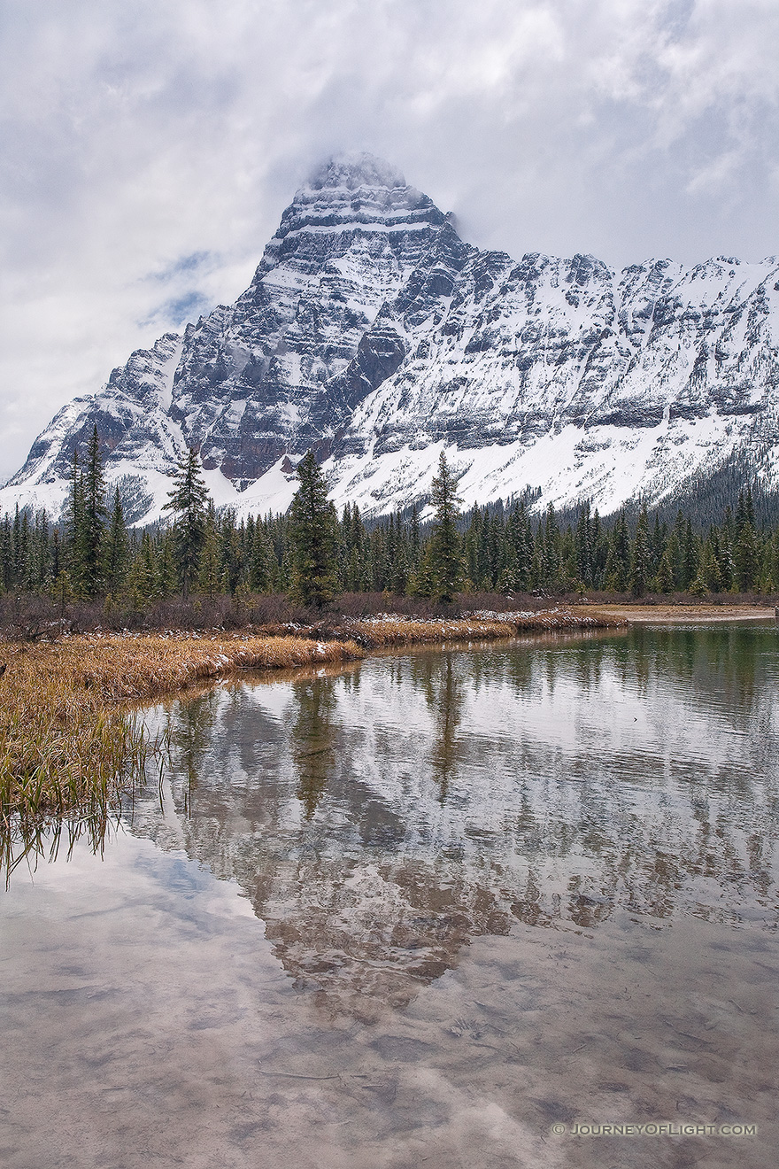 Mt. Cephron rises above the Mistaya River in Banff National Park, Alberta, Canada. - Banff Picture