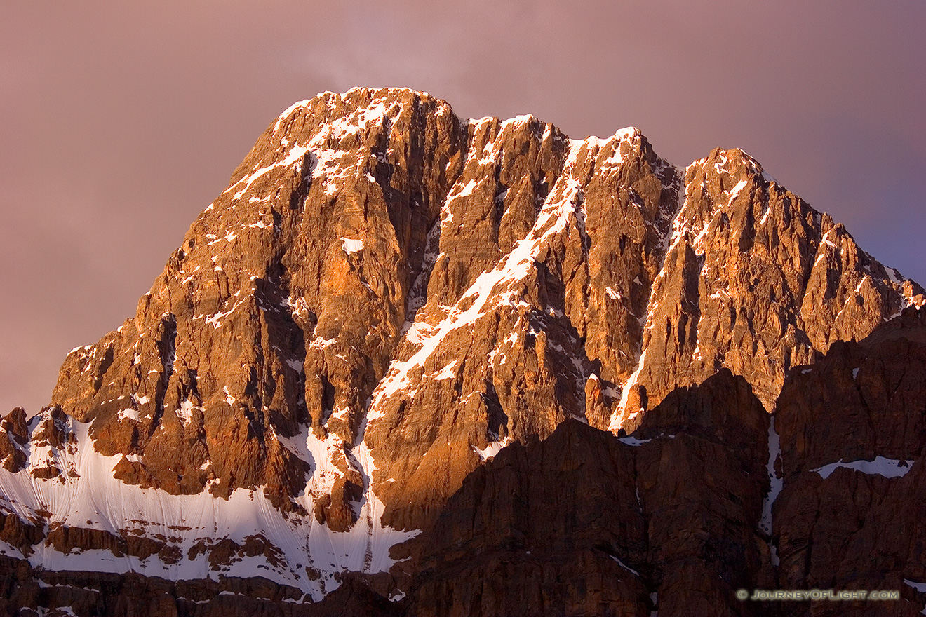 The peaks of the Bow Range with an intense glow from the rising sun. - Banff Picture